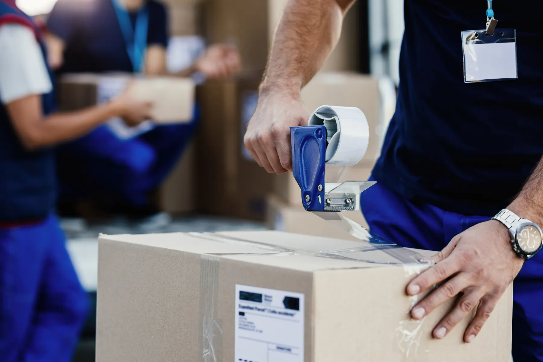 Online order being sealed in a shipping box